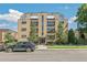 Front view of an apartment building with a car parked in front at 10 N Ogden St # 5, Denver, CO 80218