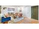 Living room with hardwood floors, modern decor, and access to other rooms at 10 N Ogden St # 5, Denver, CO 80218