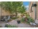 Brick patio with seating area, landscaping, and a pergola at 10 N Ogden St # 5, Denver, CO 80218