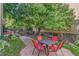 Private patio with table and chairs, nestled under a tree at 10 N Ogden St # 5, Denver, CO 80218
