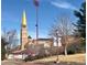 University scene featuring a clock tower, stadium, and students at 10 N Ogden St # 5, Denver, CO 80218