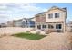 Backyard featuring a small patio and artificial turf, offering a low-maintenance outdoor space for relaxation and entertainment at 5325 Ventura St, Denver, CO 80249