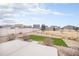Spacious backyard with a white fence, rock landscape, and a small area of grass at 5325 Ventura St, Denver, CO 80249