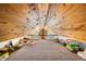 Spacious attic featuring wood-paneled vaulted ceiling with railing overlooking exterior view at 489 Harris Dr, Idaho Springs, CO 80452