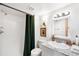 Bright bathroom with shower and updated vanity at 489 Harris Dr, Idaho Springs, CO 80452
