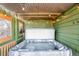 Private hot tub area with corrugated metal roof and string lights at 489 Harris Dr, Idaho Springs, CO 80452