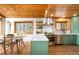Modern kitchen with stainless steel appliances and eat-in breakfast nook at 489 Harris Dr, Idaho Springs, CO 80452