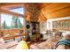 Inviting living room featuring a stone fireplace and scenic views at 489 Harris Dr, Idaho Springs, CO 80452