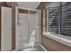 Bathroom with a walk-in shower and window at 15941 Bluebonnet Dr, Parker, CO 80134