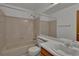 Bathroom with a tiled tub, and a mirror over the sink at 15941 Bluebonnet Dr, Parker, CO 80134