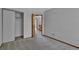 A view of a bedroom leading to a hallway and walk in closet at 15941 Bluebonnet Dr, Parker, CO 80134