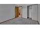 Bedroom featuring neutral carpet, closet, and view to the bathroom at 15941 Bluebonnet Dr, Parker, CO 80134