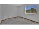 Well lit bedroom with neutral carpet, walls, and wood trim at 15941 Bluebonnet Dr, Parker, CO 80134