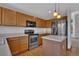 Well-lit kitchen featuring stainless steel appliances, ample counter space and sleek white countertops at 15941 Bluebonnet Dr, Parker, CO 80134