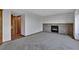 Cozy living room with fireplace and natural light, offering a warm and inviting atmosphere at 15941 Bluebonnet Dr, Parker, CO 80134