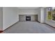 Bright and open living area featuring a brick fireplace and a large window with scenic outdoor views at 15941 Bluebonnet Dr, Parker, CO 80134