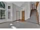Bright living room with high ceilings, carpet floors, and natural light from large windows at 15941 Bluebonnet Dr, Parker, CO 80134