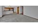 Open living space with a partial view of the kitchen, fireplace and large amounts of floor space at 15941 Bluebonnet Dr, Parker, CO 80134