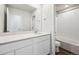 Modern bathroom with double sinks, quartz counters, and a shower/tub combo at 18958 E 94Th Pl, Commerce City, CO 80022