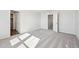 Bright bedroom features neutral paint, plush carpet, and a walk-in closet at 18958 E 94Th Pl, Commerce City, CO 80022
