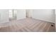Spacious loft area with plush neutral carpeting and multiple entry doors at 18958 E 94Th Pl, Commerce City, CO 80022