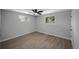 Bright, spacious bedroom features large windows, ceiling fan, and modern flooring at 9227 W 67Th Ave, Arvada, CO 80004