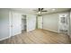 Spacious bedroom features modern flooring, closet, and access to an ensuite bathroom at 9227 W 67Th Ave, Arvada, CO 80004