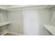 Walk-in closet with custom shelves and ample storage space in neutral tones at 9227 W 67Th Ave, Arvada, CO 80004