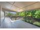 Covered, spacious outdoor deck perfect for entertaining with backyard views at 9227 W 67Th Ave, Arvada, CO 80004