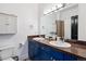 Bright bathroom with dual sinks, granite countertops, modern fixtures, and generous storage at 2524 Champa St # 4, Denver, CO 80205