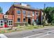 Charming brick building featuring architectural details, a rooftop terrace, and street-level access to local businesses at 2524 Champa St # 4, Denver, CO 80205
