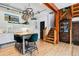Bright, updated kitchen featuring modern appliances, sleek cabinetry, a center island, and seamless access to a staircase at 2524 Champa St # 4, Denver, CO 80205