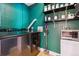 Spacious laundry room with modern washer, dryer, shelving, and storage, a convenient home addition at 2524 Champa St # 4, Denver, CO 80205