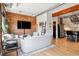 Open-concept living area featuring exposed brick, hardwood floors, and seamless flow into the modern kitchen space at 2524 Champa St # 4, Denver, CO 80205