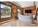 Bright living room with hardwood floors, exposed brick, large windows, and contemporary furniture for modern living at 2524 Champa St # 4, Denver, CO 80205