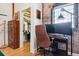 Bright office space featuring a large window, exposed brick and a peek into the spacious closet at 2524 Champa St # 4, Denver, CO 80205