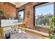 Inviting home office with exposed brick wall, bright windows and sleek, modern decor at 2524 Champa St # 4, Denver, CO 80205