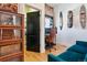 Home office showcasing brick wall, modern furniture, and closet access, an ideal workspace at 2524 Champa St # 4, Denver, CO 80205
