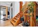 Striking wooden staircase with wooden handrail and brick accents, a charming architectural feature at 2524 Champa St # 4, Denver, CO 80205