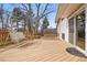 Large wooden deck with seating area and a swing at 11950 E Exposition Ave, Aurora, CO 80012