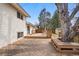 Spacious back deck with outdoor seating and mature trees at 11950 E Exposition Ave, Aurora, CO 80012