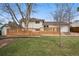 Expansive backyard with a wooden deck and lots of room to relax and entertain at 11950 E Exposition Ave, Aurora, CO 80012