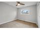 Bright bedroom with neutral carpet and a ceiling fan at 11950 E Exposition Ave, Aurora, CO 80012