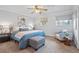 Cozy bedroom with natural light, carpeted floors, and soft blue accents at 11950 E Exposition Ave, Aurora, CO 80012