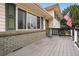 Close-up showing the home's entrance, charming porch, and attractive brickwork at 11950 E Exposition Ave, Aurora, CO 80012