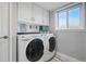 Bright laundry room featuring a washer and dryer at 11950 E Exposition Ave, Aurora, CO 80012