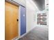 Hallway with carpet and a view of the exterior through the windows at 2958 Syracuse St # 317, Denver, CO 80238