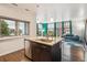 Open kitchen with granite countertops, stainless steel appliances, and view of living area at 2958 Syracuse St # 317, Denver, CO 80238