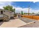 Private backyard with a patio, storage shed, and a wooden fence, creating an outdoor living space at 3501 W 53Rd Ave, Denver, CO 80221