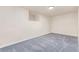 Unfinished basement with neutral carpet and a recessed niche on the wall at 3501 W 53Rd Ave, Denver, CO 80221